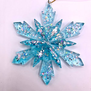 Snowflake Christmas ornament ice blue resin with holographic sparkle